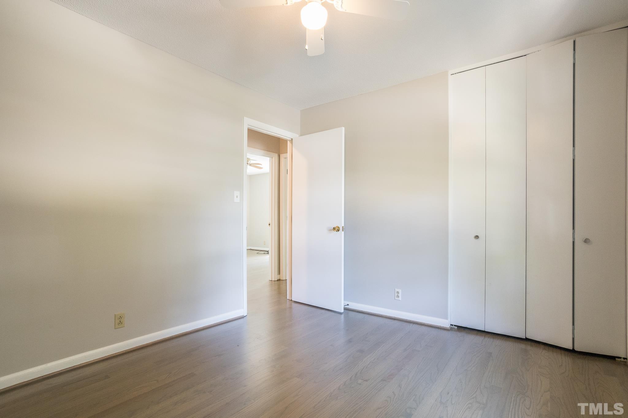 3715 Tulane Drive Raleigh, NC 27604 - Photo 26 of 39 a view of an empty room with wooden floor