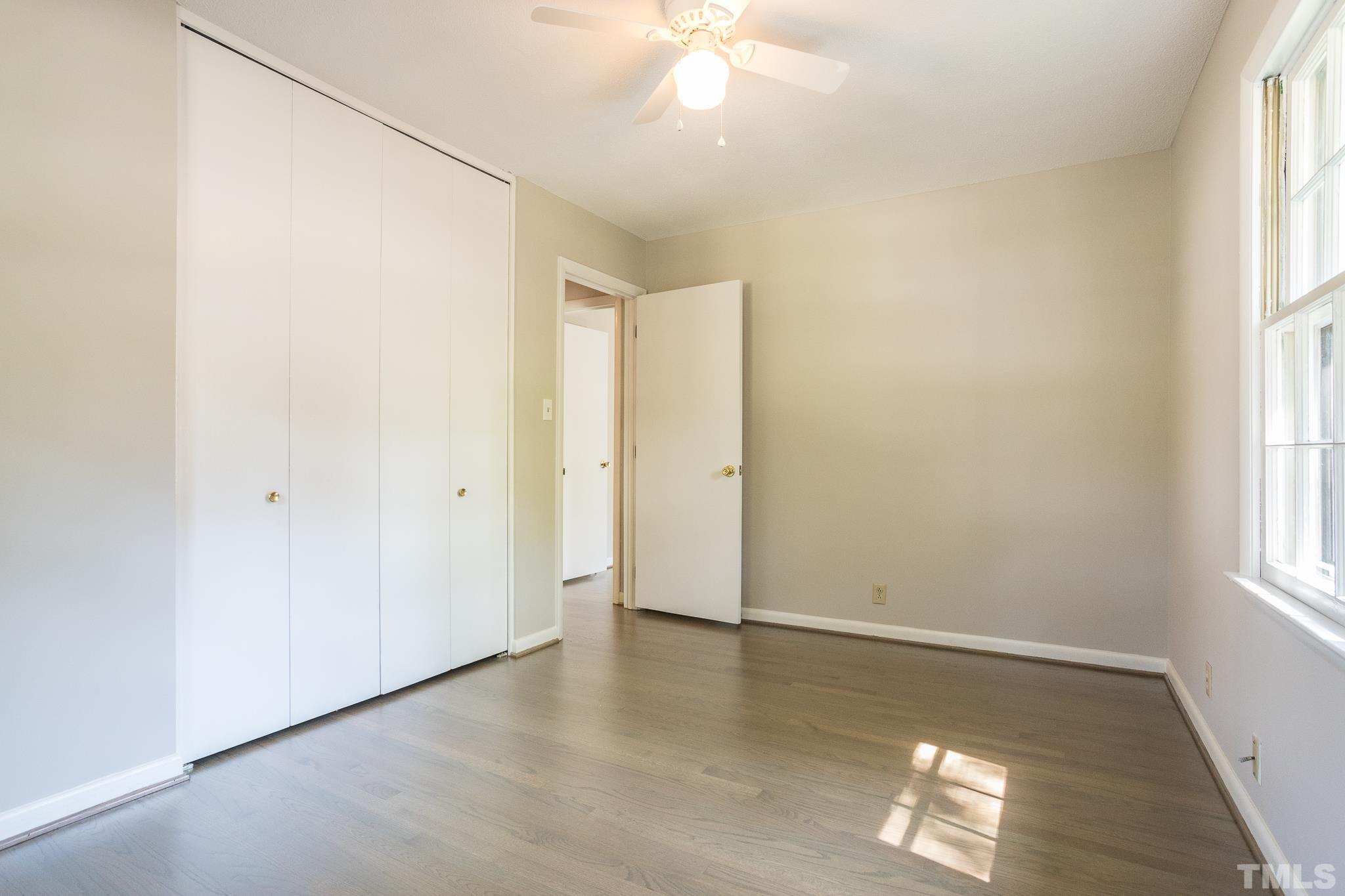 3715 Tulane Drive Raleigh, NC 27604 - Photo 28 of 39 an empty room with wooden floor and windows