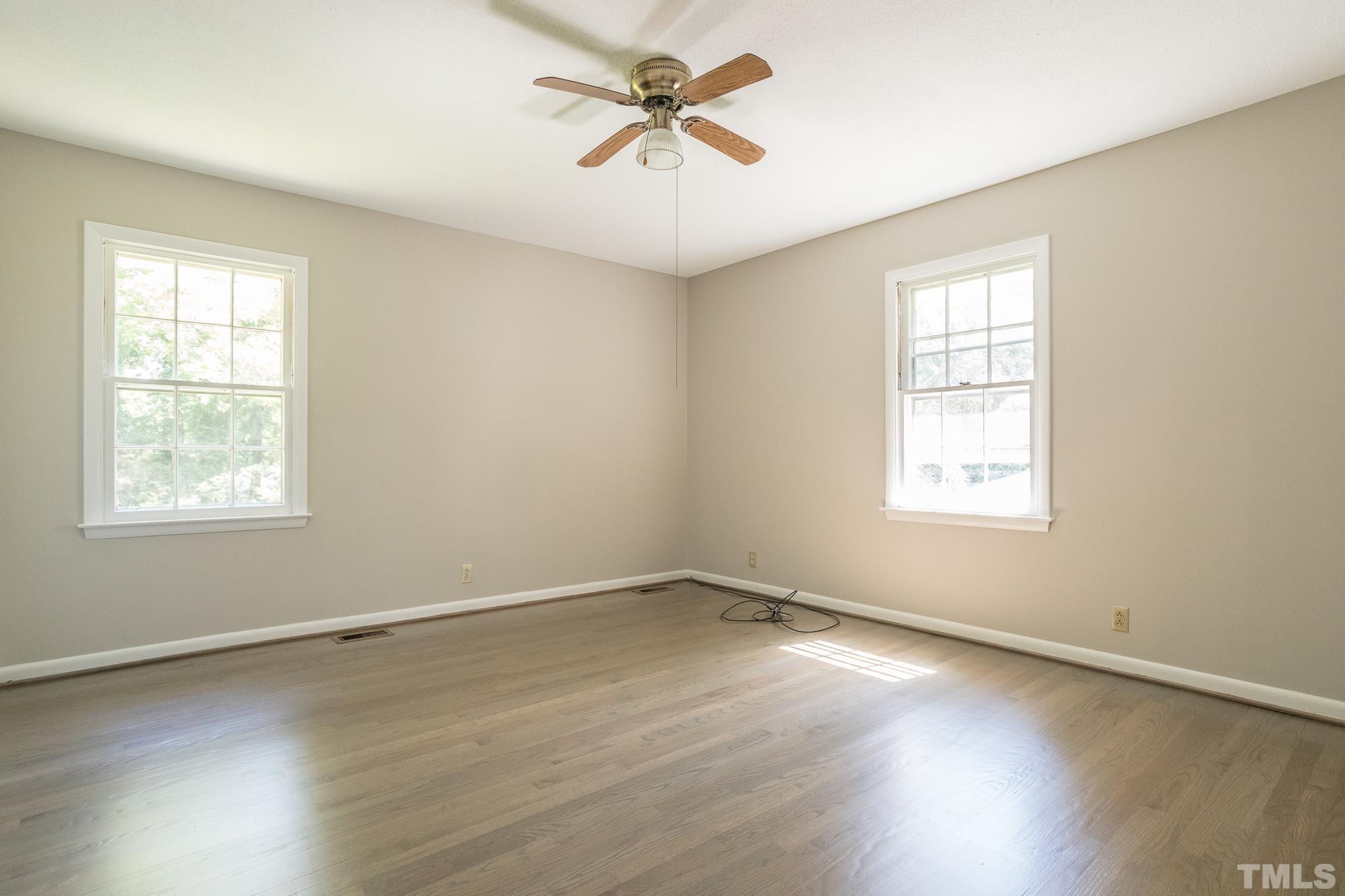 3715 Tulane Drive Raleigh, NC 27604 - Photo 29 of 39 wooden floor in an empty room with a window