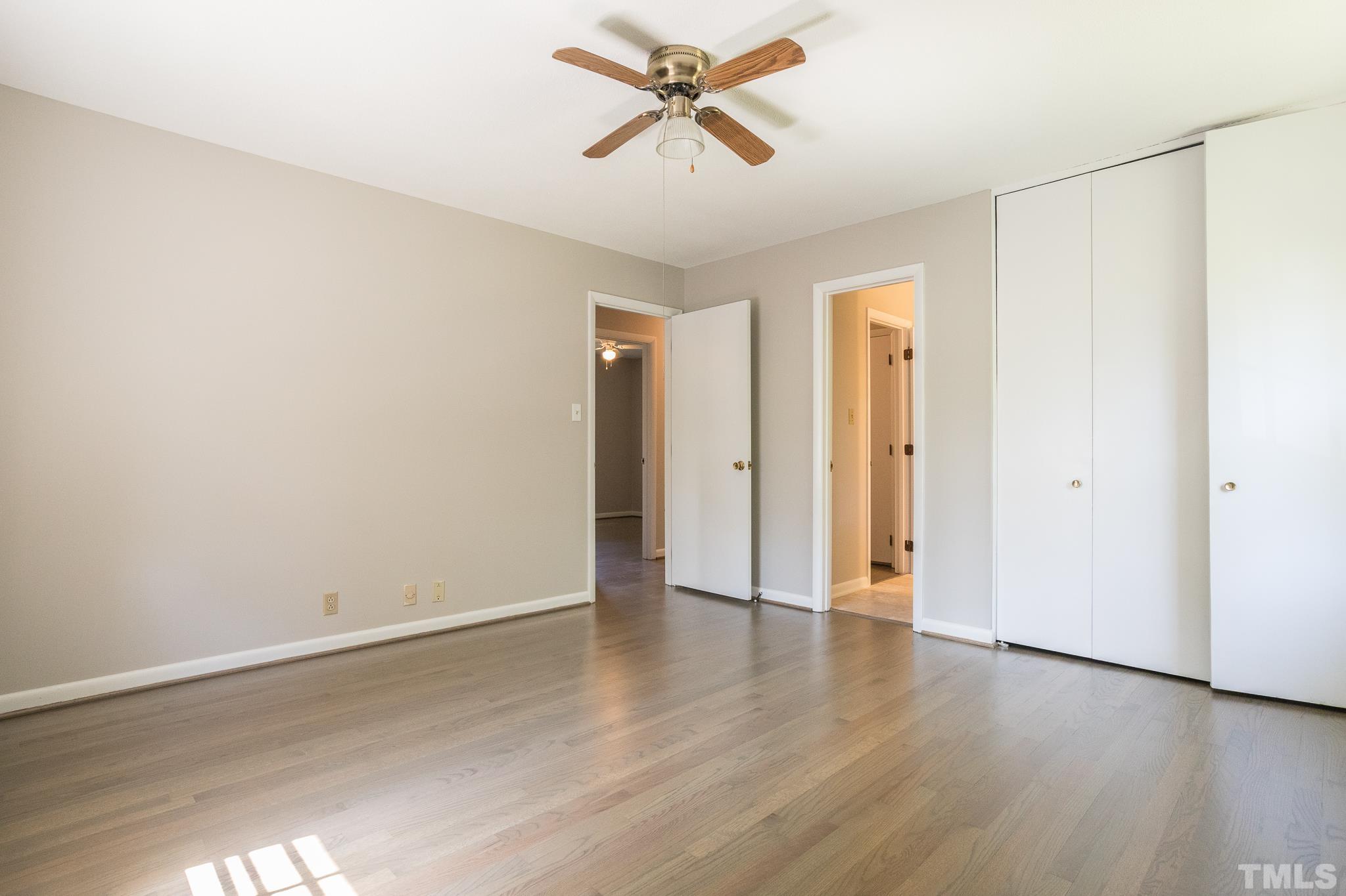 3715 Tulane Drive Raleigh, NC 27604 - Photo 30 of 39 an empty room with wooden floor and a ceiling fan
