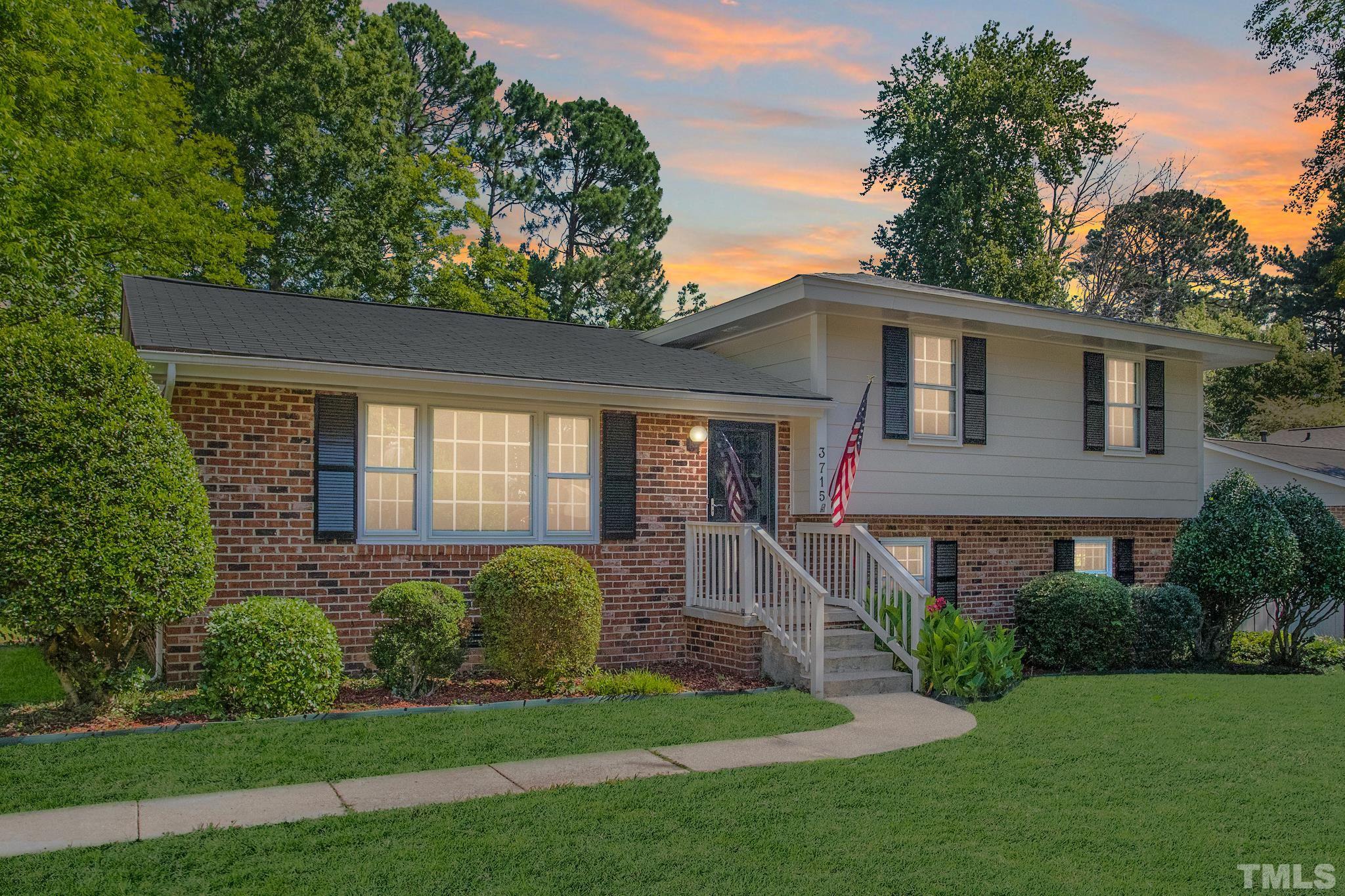 3715 Tulane Drive Raleigh, NC 27604 - Photo 3 of 39 a front view of a house with a yard