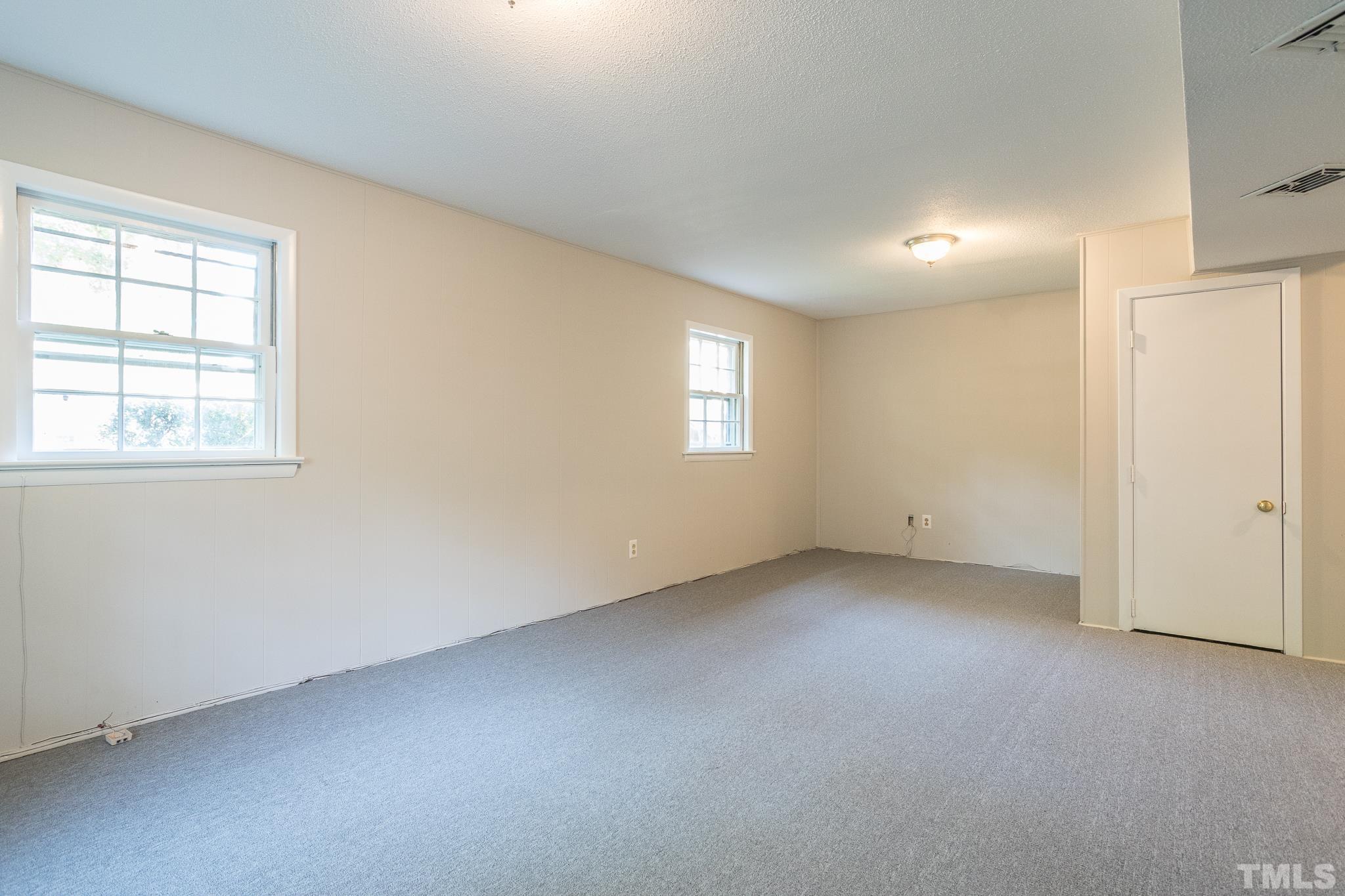 3715 Tulane Drive Raleigh, NC 27604 - Photo 33 of 39 an empty room with windows