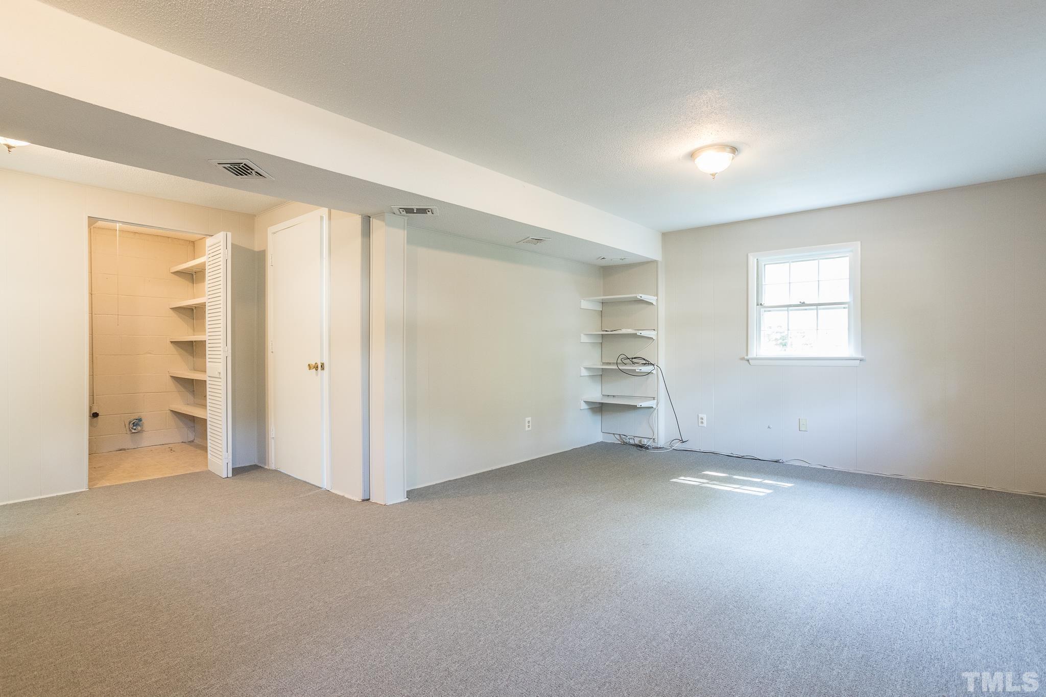 3715 Tulane Drive Raleigh, NC 27604 - Photo 35 of 39 an empty room with windows and closet