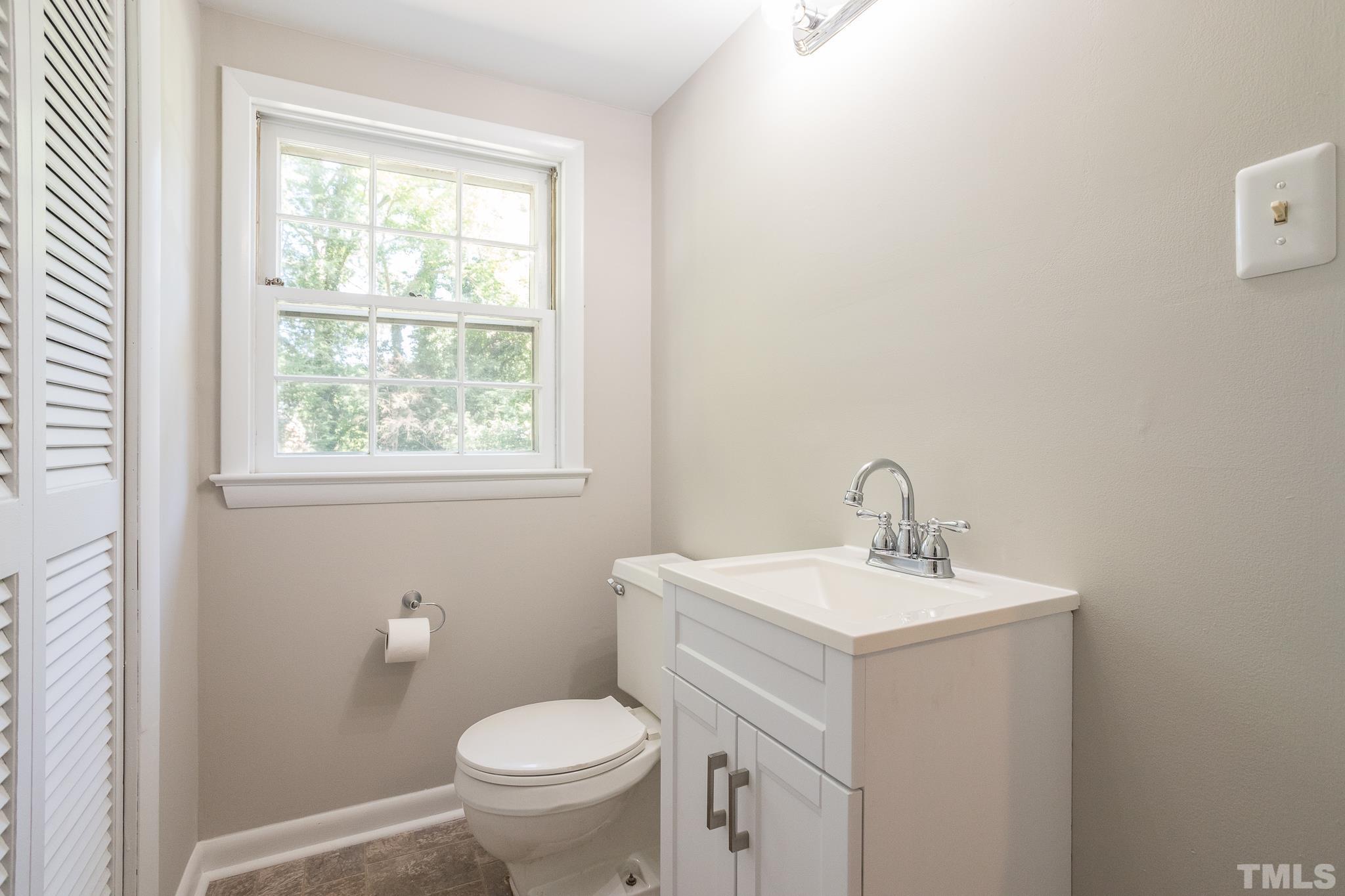 3715 Tulane Drive Raleigh, NC 27604 - Photo 36 of 39 a bathroom with a sink toilet and a window