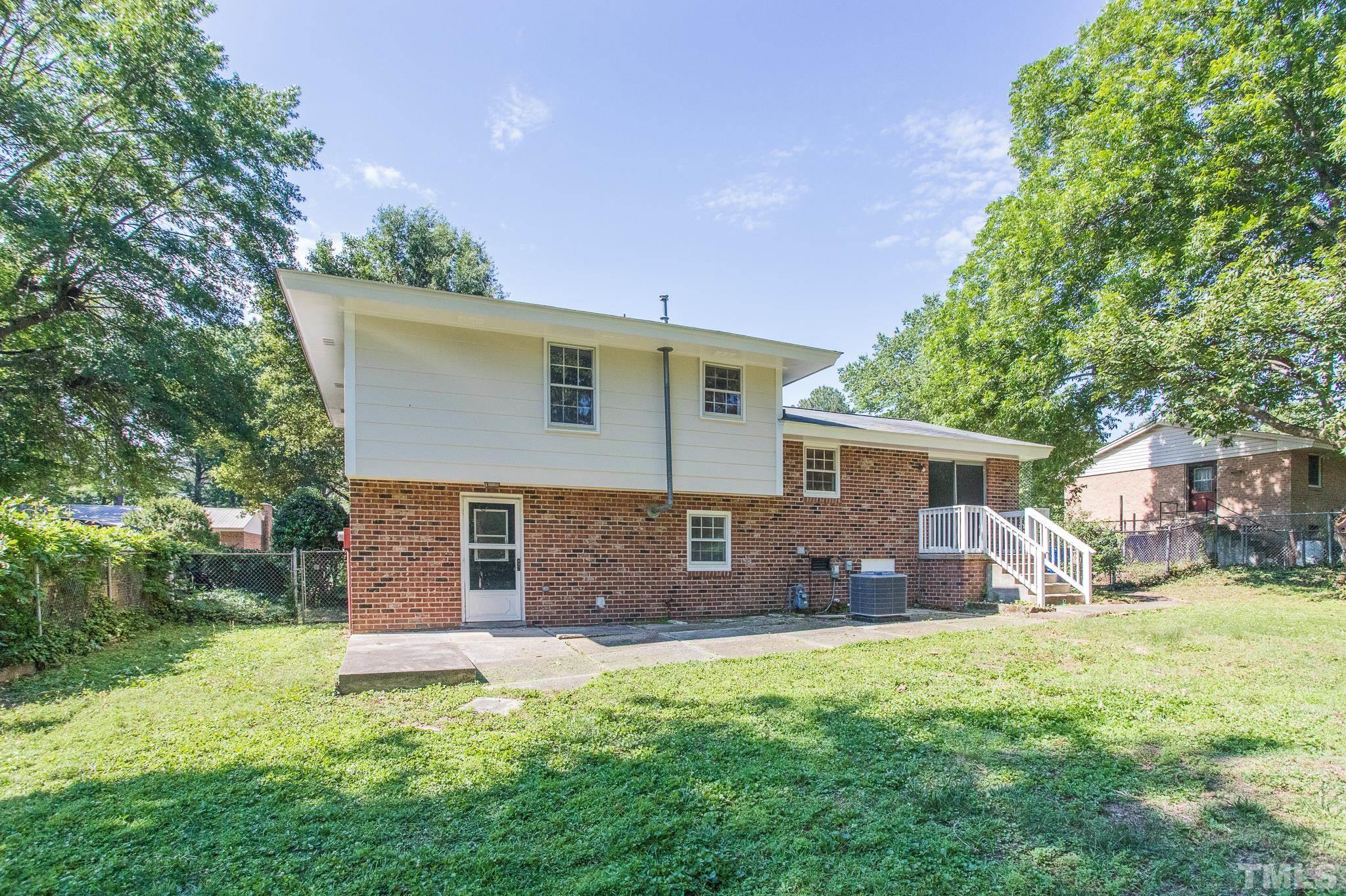 3715 Tulane Drive Raleigh, NC 27604 - Photo 9 of 39 a front view of a house with a yard and garage