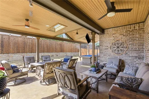 a view of a patio with table and chairs
