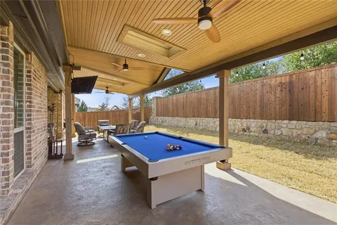 a living room with a table and chairs
