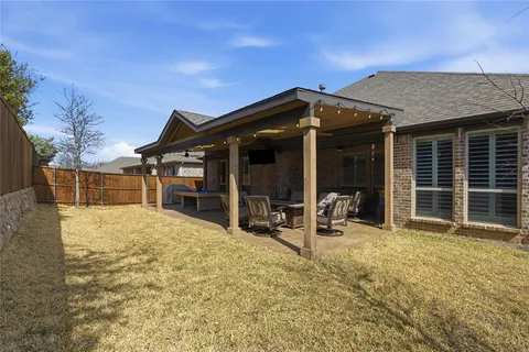 a view of house with yard and seating space