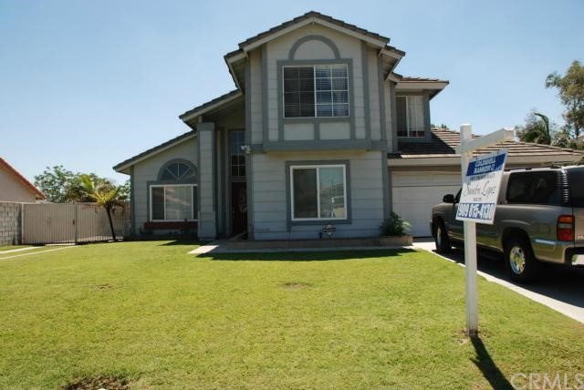 1657 West Victoria Street Rialto, CA 92376 - Photo 1 of 1 Front of house with large front yard