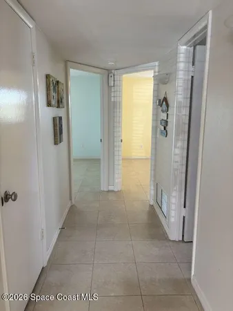 a bathroom with a glass door shower