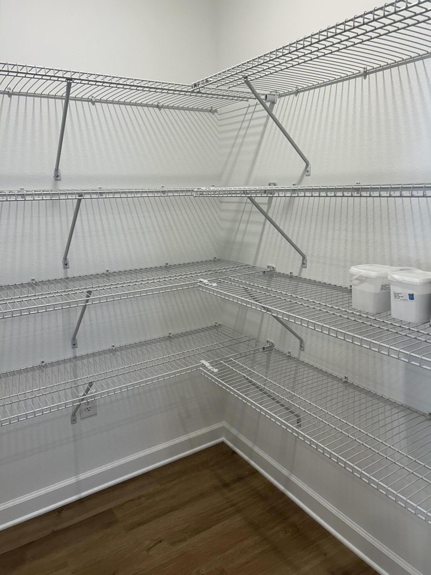 585 Brock Avenue Crestview, FL 32539 - Photo 12 of 29 a view of a room with racks on the wall