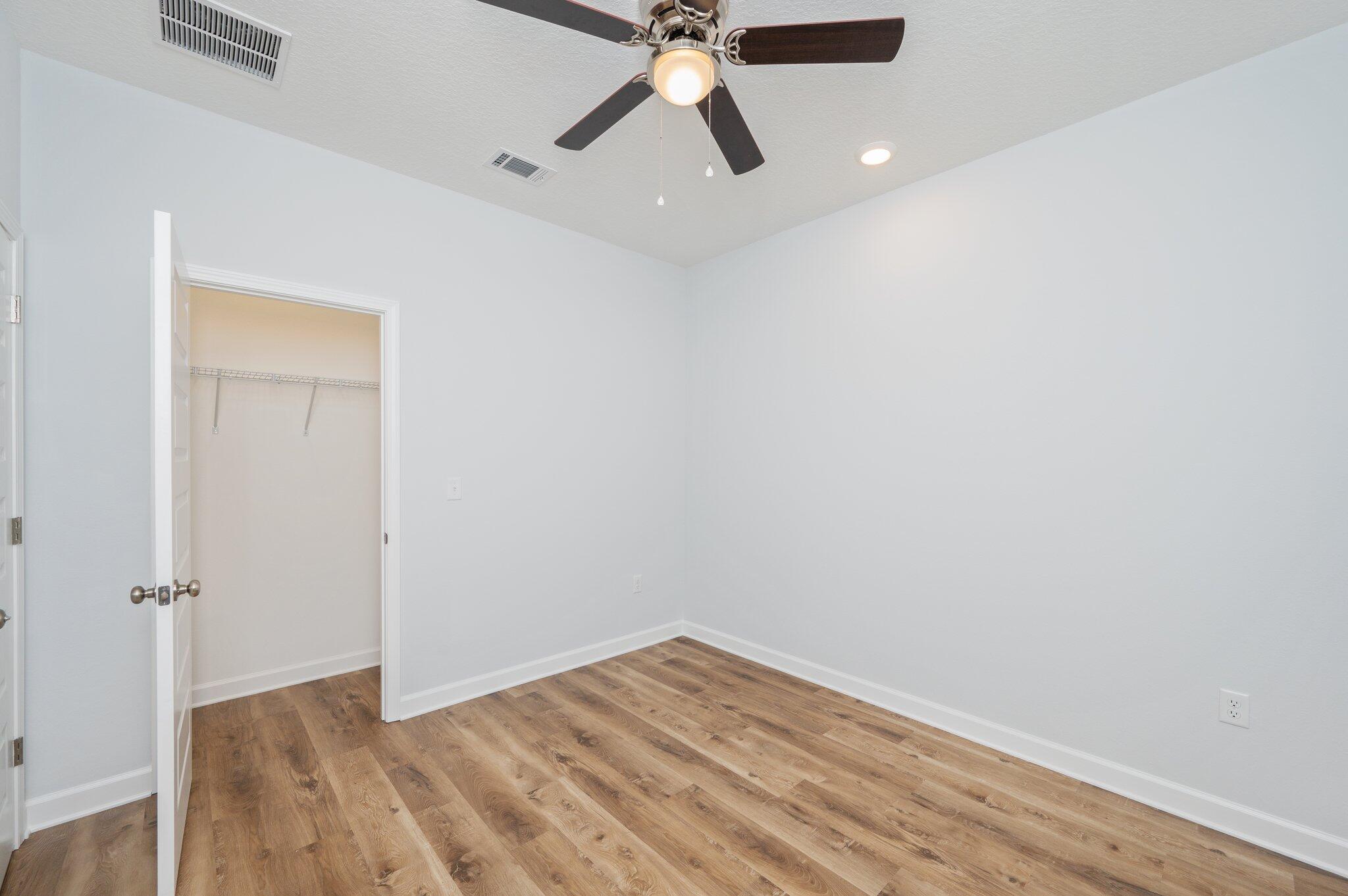 585 Brock Avenue Crestview, FL 32539 - Photo 16 of 29 wooden floor in an empty room