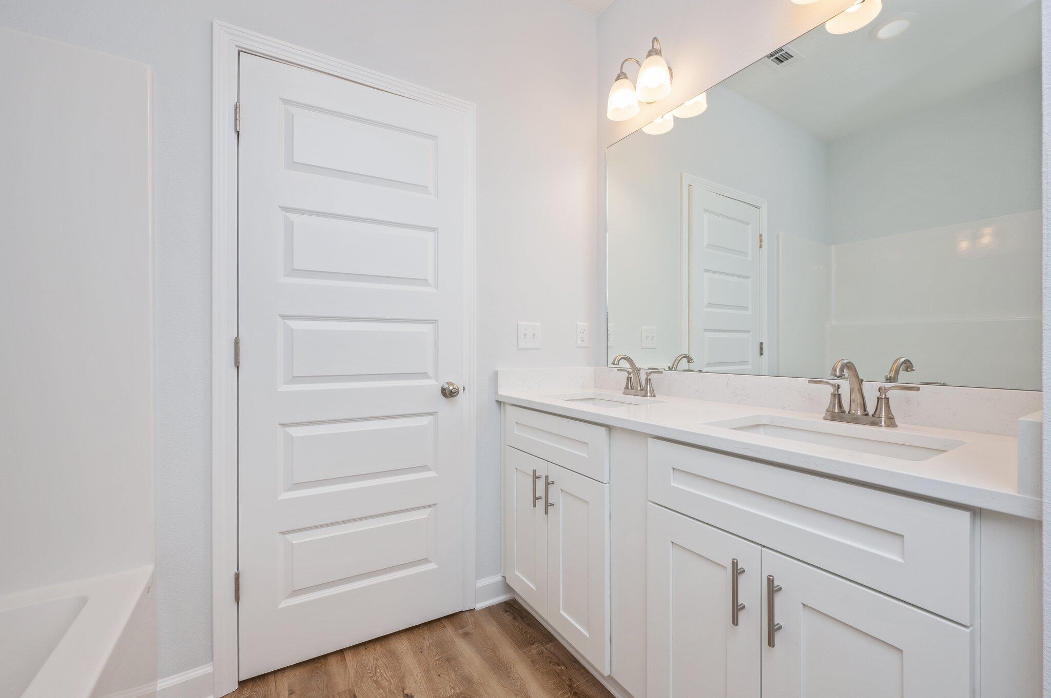 585 Brock Avenue Crestview, FL 32539 - Photo 27 of 29 a bathroom with a sink vanity and a mirror