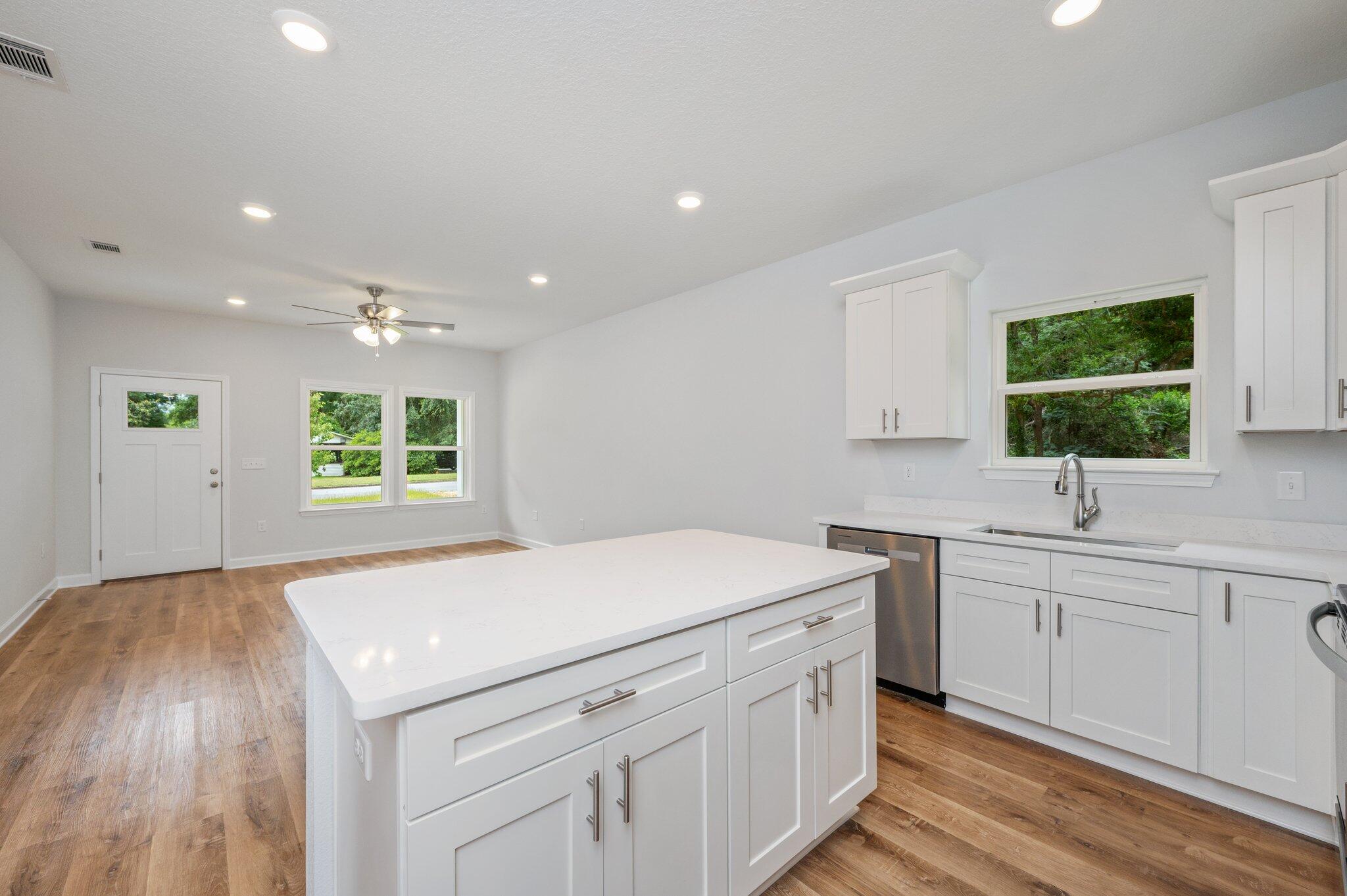 585 Brock Avenue Crestview, FL 32539 - Photo 10 of 29 a kitchen that has a sink and a stove in it