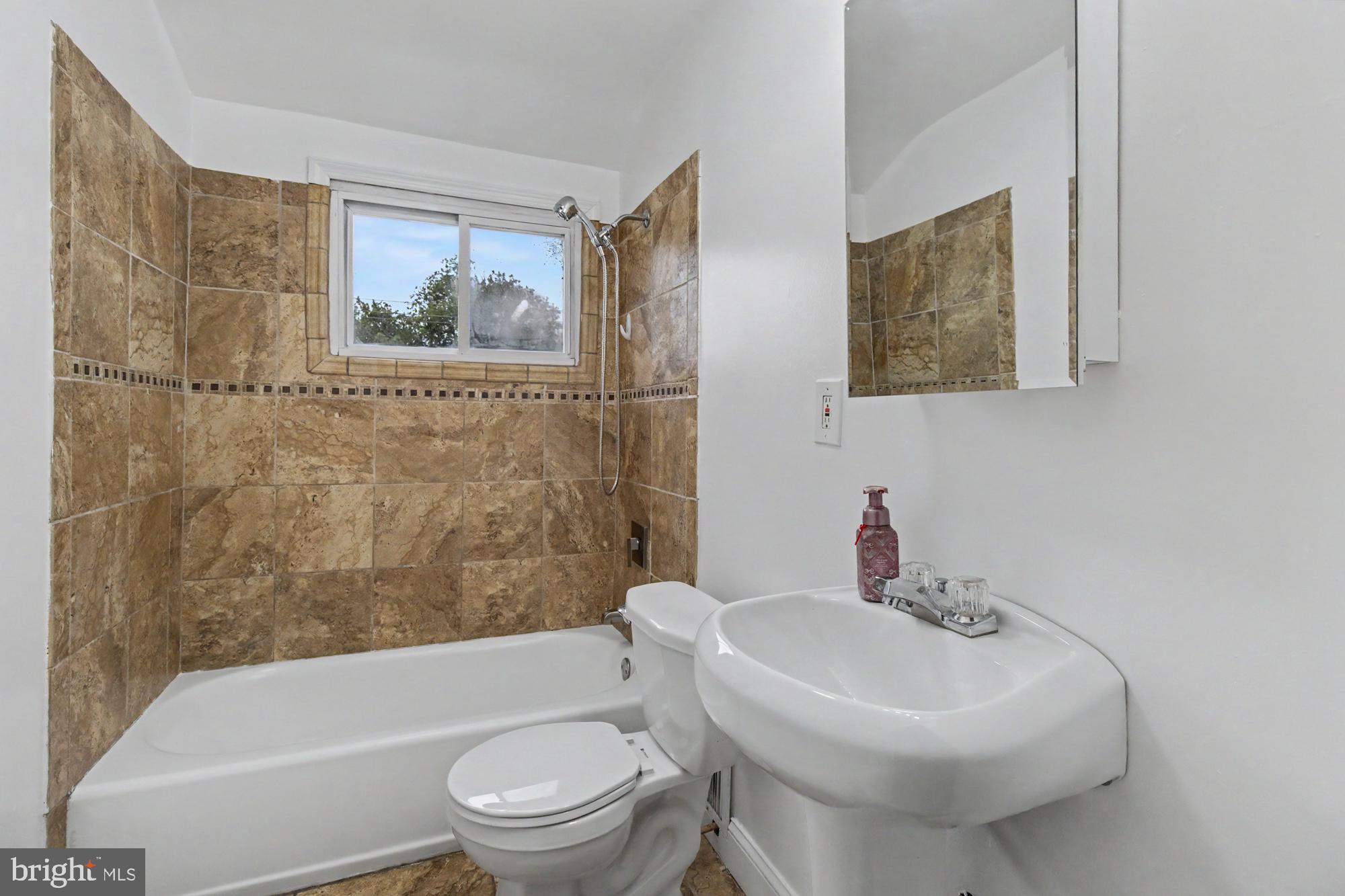 8218 Kavanagh Road Dundalk, MD 21222 - Photo 21 of 39 Modern bathroom with elegant tiles.