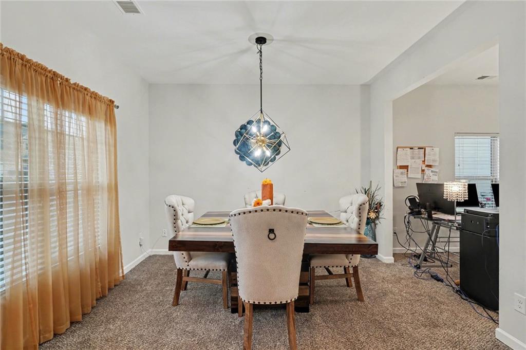 1241 England Terrace Hampton, GA 30228 - Photo 5 of 20 a view of a dining room with furniture window and outside view