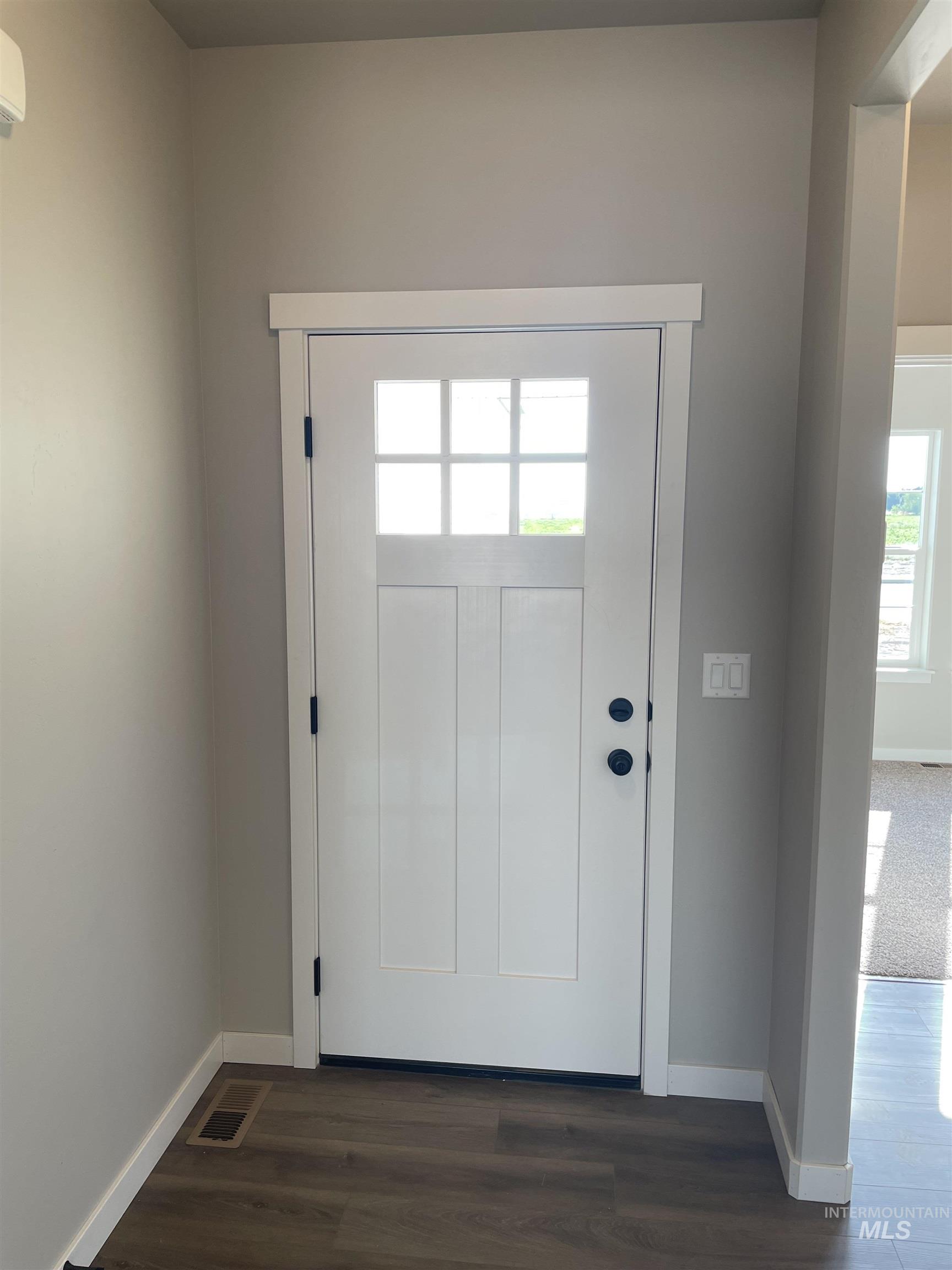 2036 Harrison Street South Twin Falls, ID 83301 - Photo 16 of 17 Foyer entrance with baseboards and dark wood-style floors