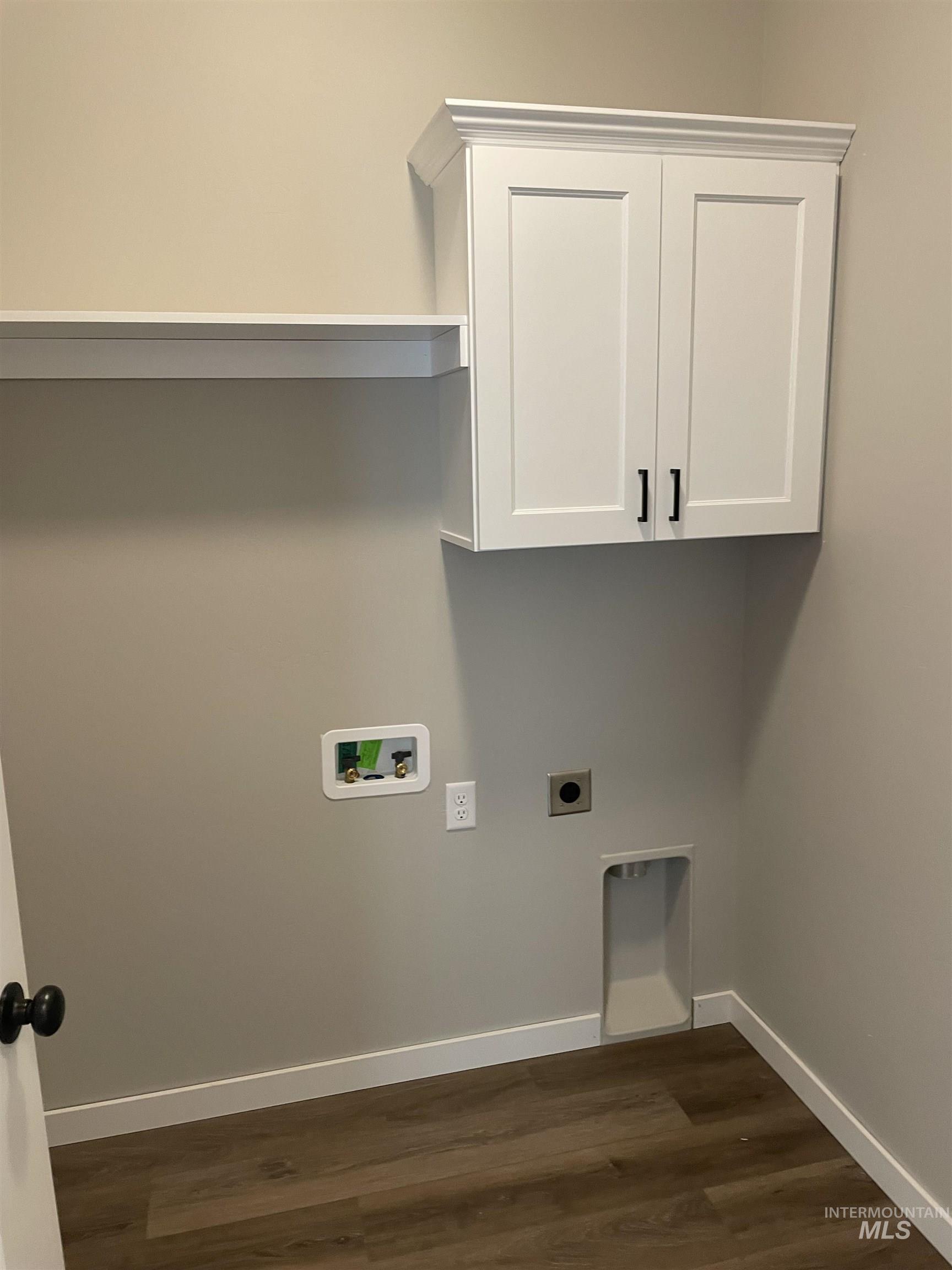 2036 Harrison Street South Twin Falls, ID 83301 - Photo 17 of 17 Laundry area featuring hookup for an electric dryer, dark wood-style floors, cabinet space, and washer hookup