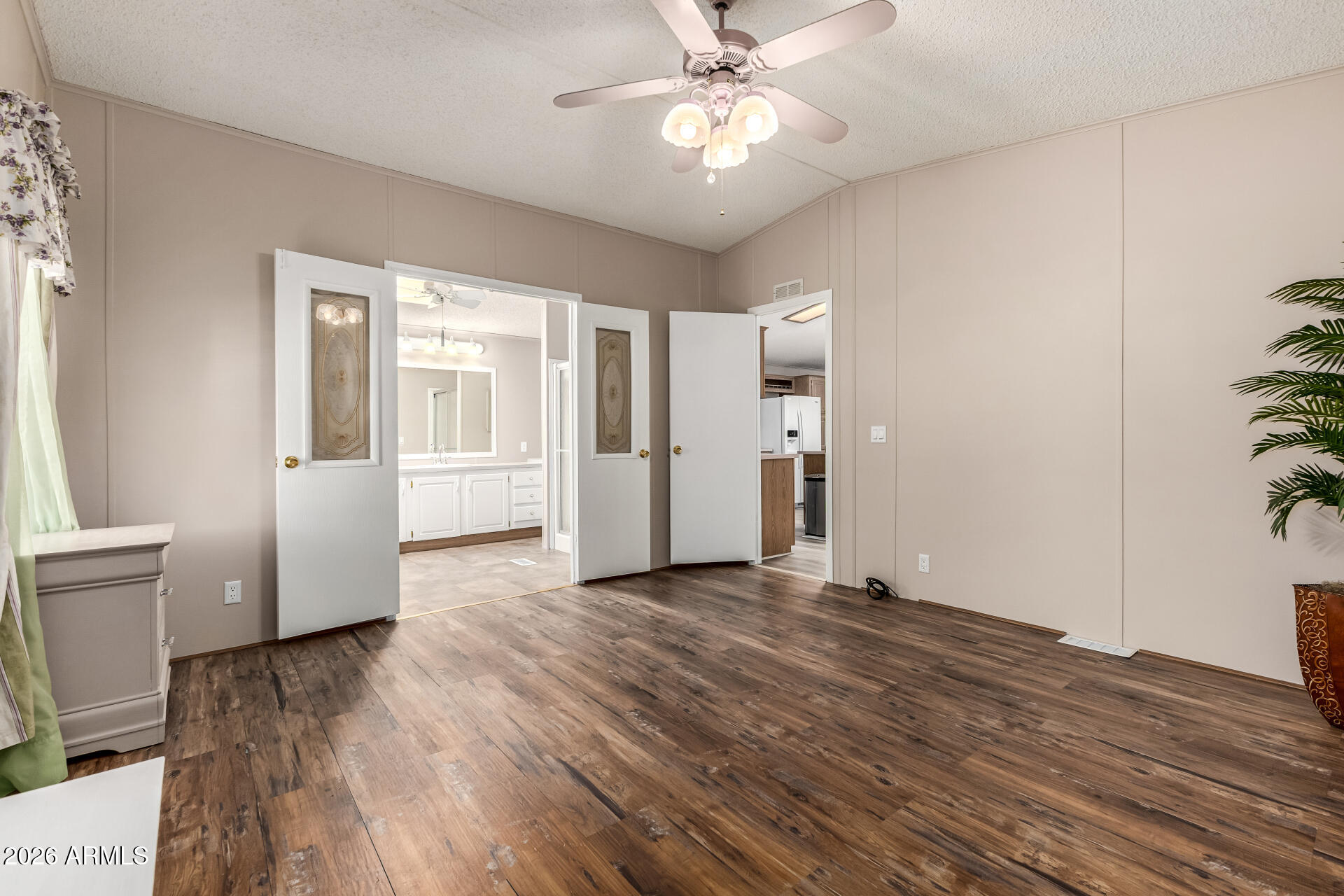 3330 East Main Street, Unit 446 Mesa, AZ 85213 - Photo 15 of 29 a view of an empty room with a window and wooden floor