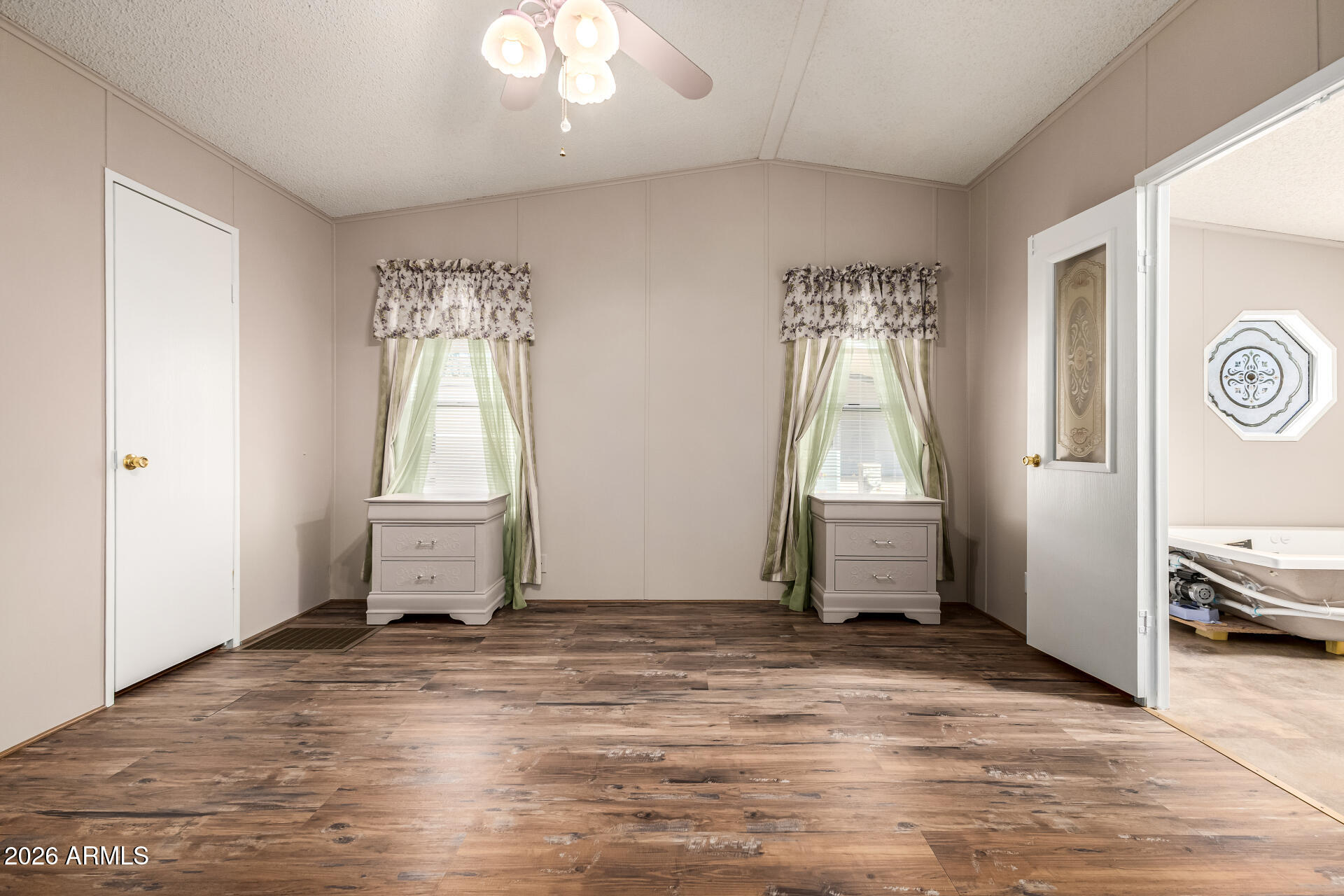 3330 East Main Street, Unit 446 Mesa, AZ 85213 - Photo 16 of 29 a view of a room with window and hardwood floor