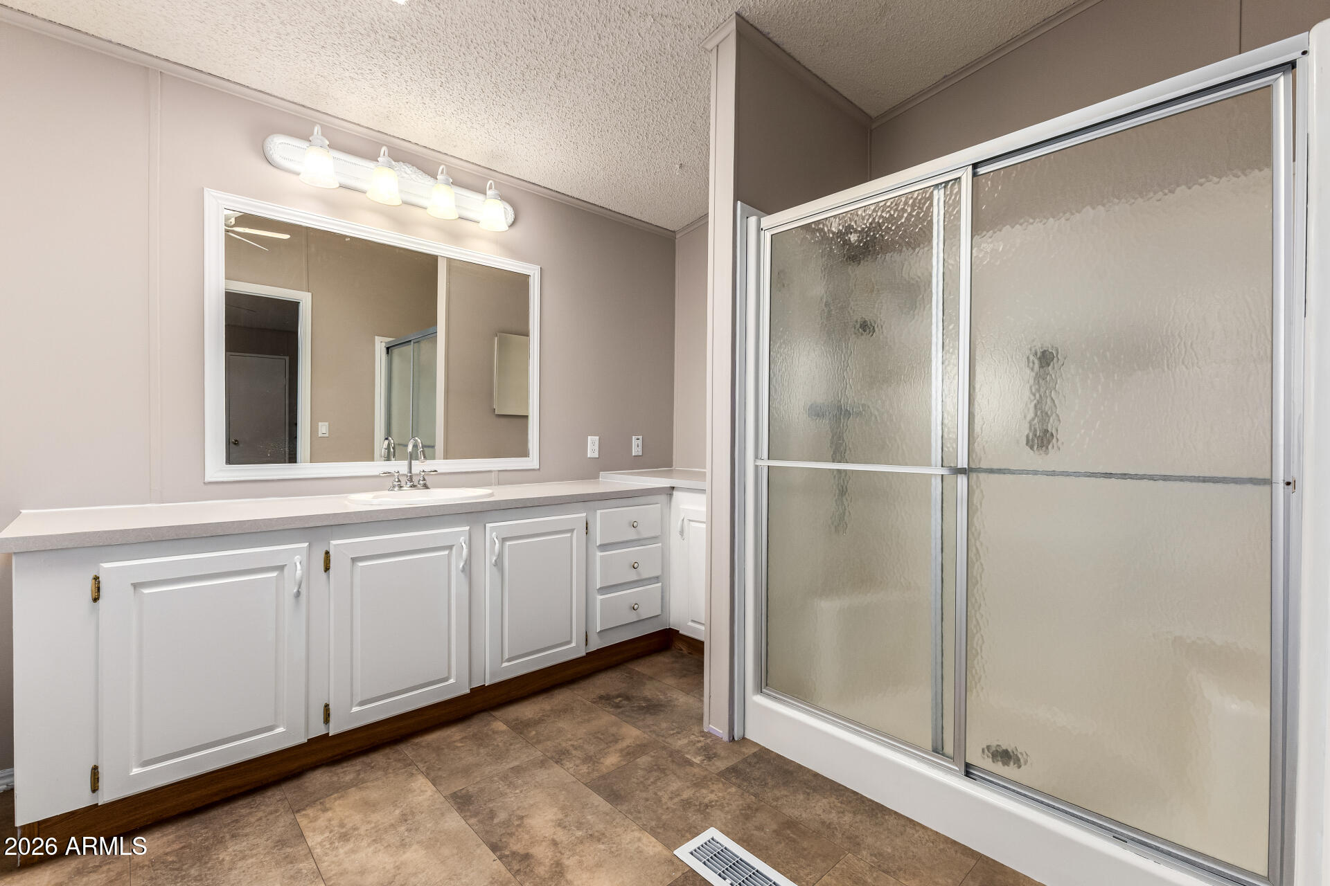 3330 East Main Street, Unit 446 Mesa, AZ 85213 - Photo 17 of 29 a bathroom with a double vanity sink and a mirror