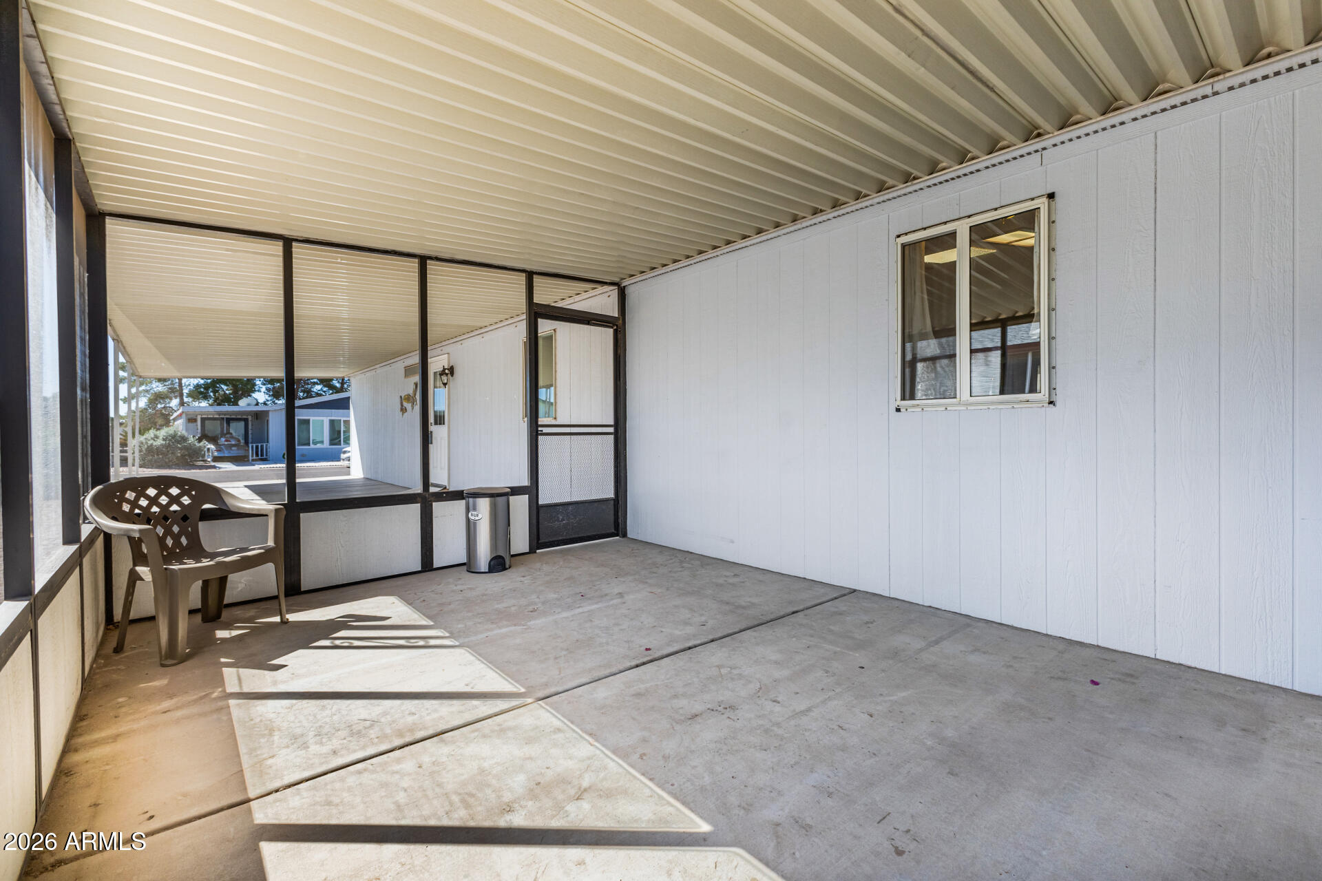 3330 East Main Street, Unit 446 Mesa, AZ 85213 - Photo 27 of 29 a view of an empty room with glass door