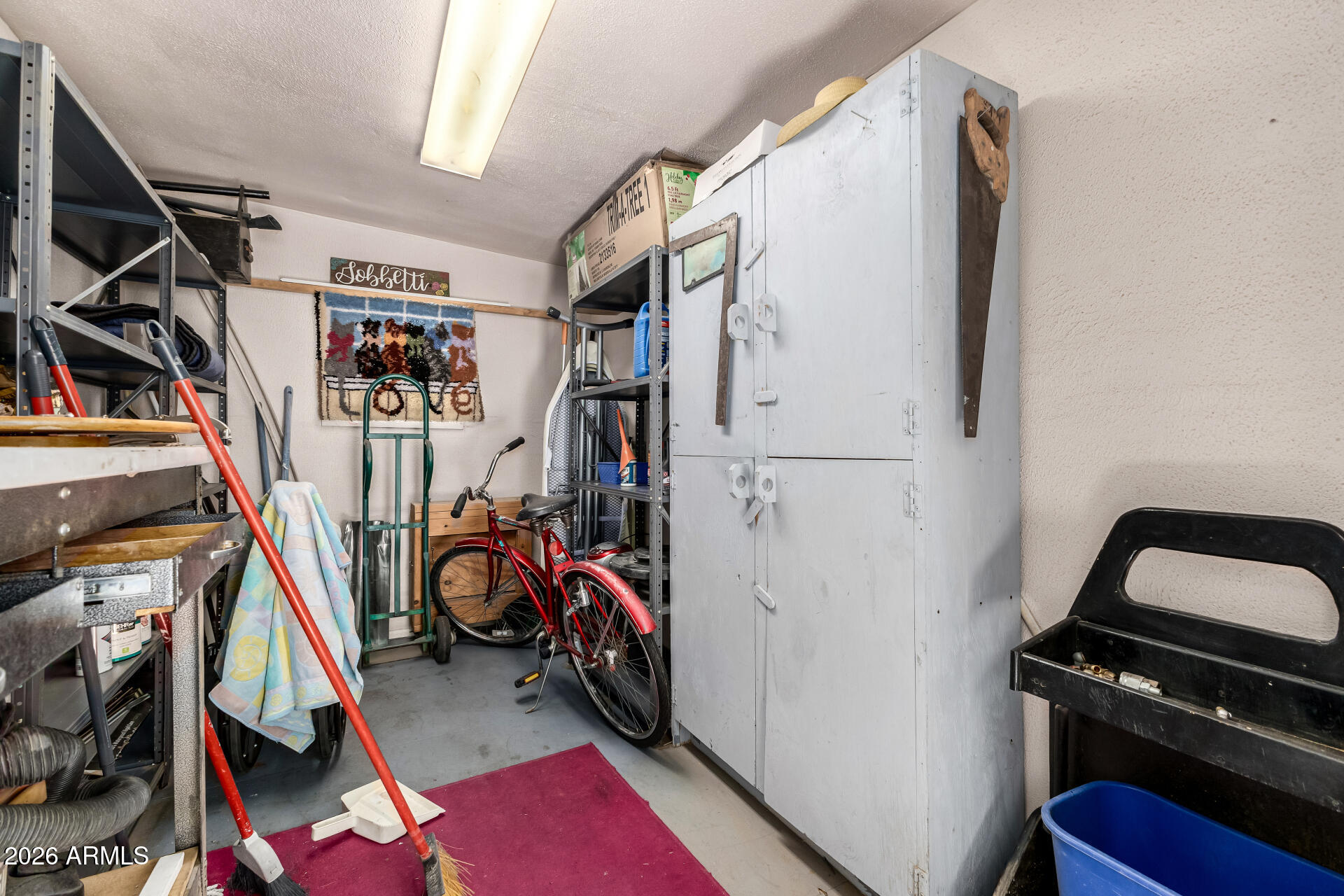 3330 East Main Street, Unit 446 Mesa, AZ 85213 - Photo 28 of 29 a view of walk in closet with clothes and shoes