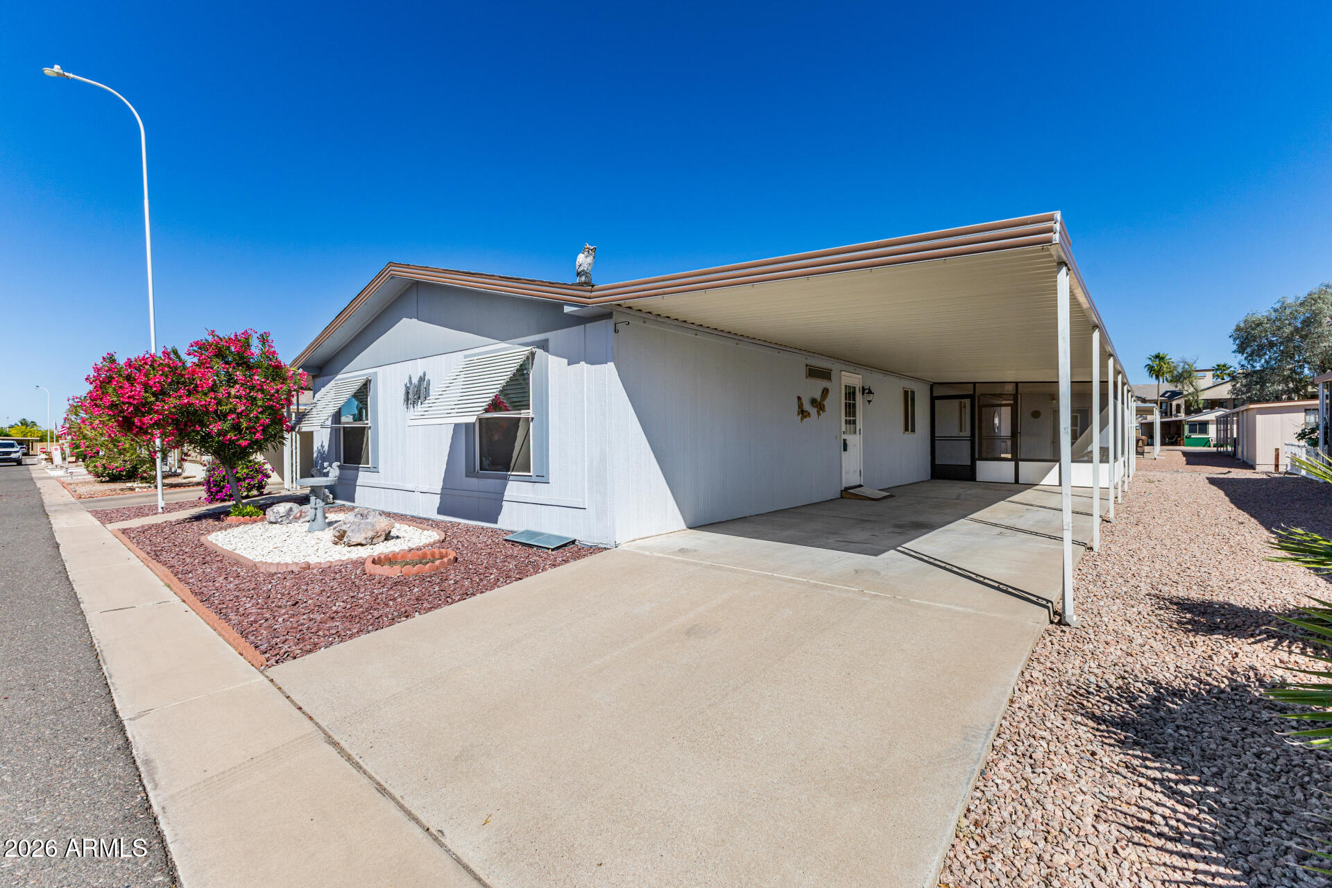 3330 East Main Street, Unit 446 Mesa, AZ 85213 - Photo 3 of 29 a front view of a house with entertaining space