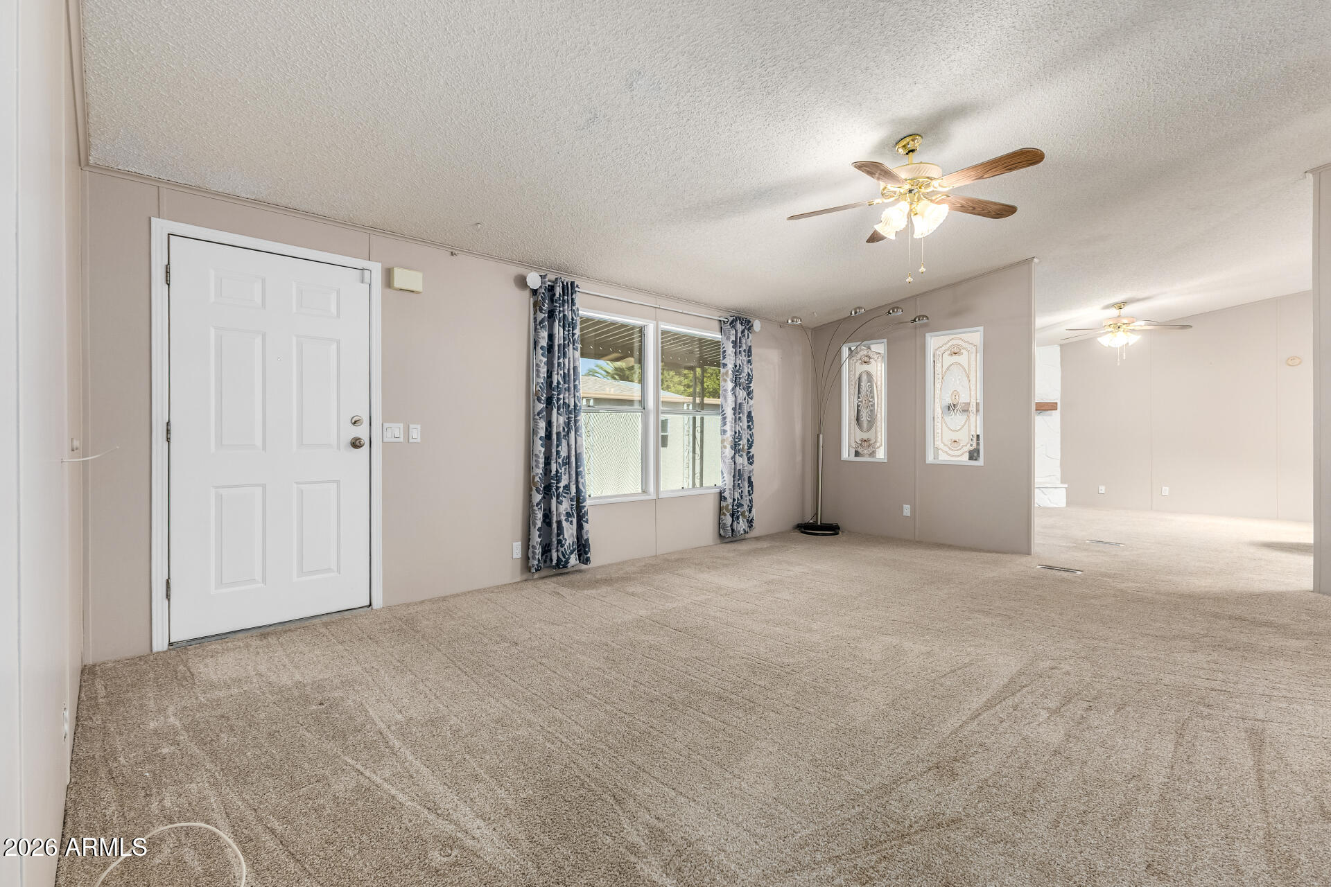 3330 East Main Street, Unit 446 Mesa, AZ 85213 - Photo 4 of 29 a view of an empty room with a window