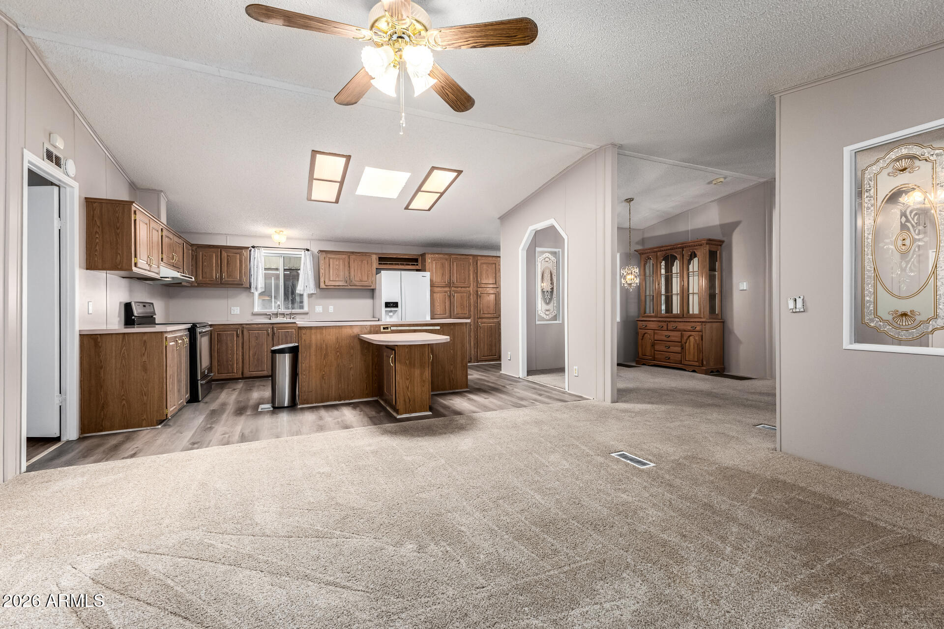 3330 East Main Street, Unit 446 Mesa, AZ 85213 - Photo 7 of 29 a view of a kitchen with a sink cabinets and a kitchen