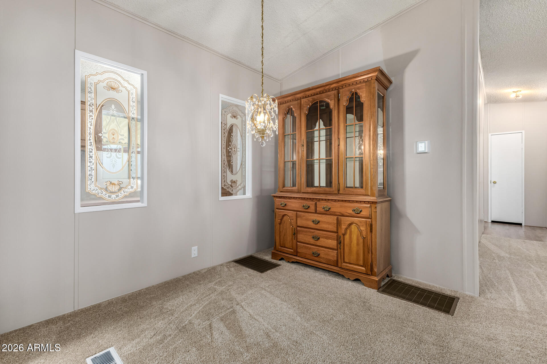 3330 East Main Street, Unit 446 Mesa, AZ 85213 - Photo 9 of 29 an empty room with windows