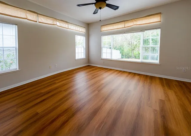a view of room window and wooden floor