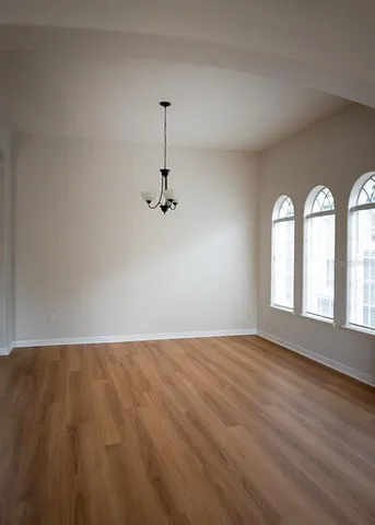 a view of empty room with windows