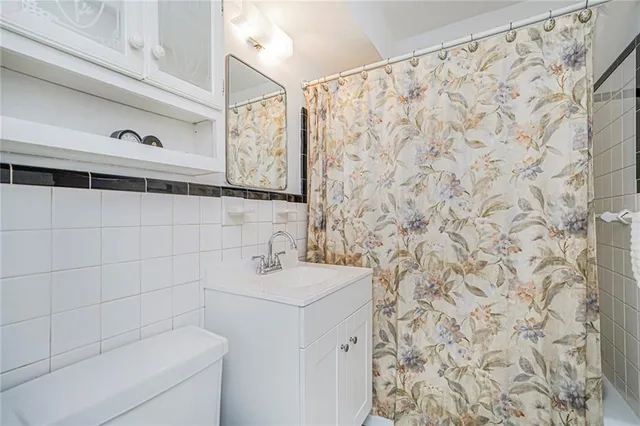 a bathroom with a sink and shower