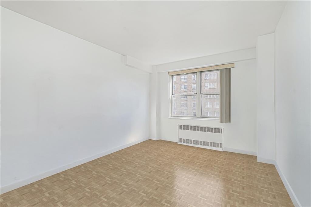 1935 Shore Parkway, Unit 9F Brooklyn, NY 11214 - Photo 19 of 20 an empty room with a window