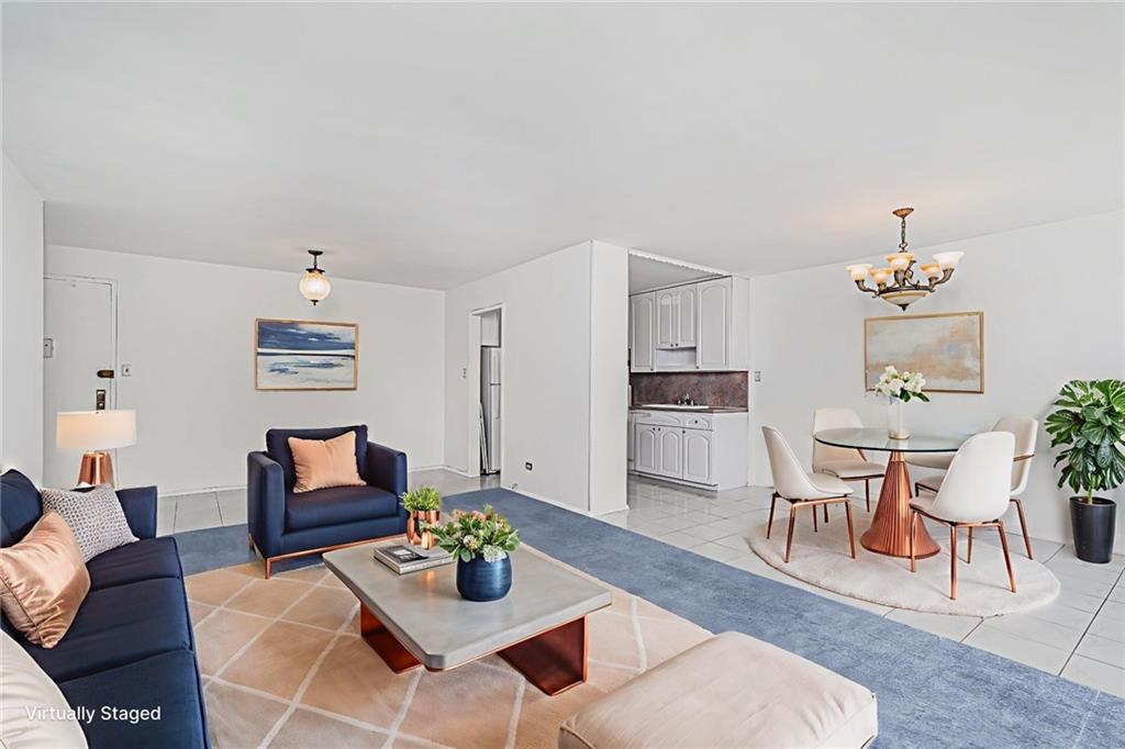 1935 Shore Parkway, Unit 9F Brooklyn, NY 11214 - Photo 2 of 20 a living room with furniture and a kitchen view