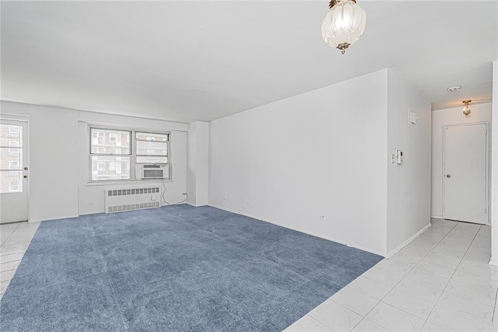 1935 Shore Parkway, Unit 9F Brooklyn, NY 11214 - Photo 3 of 20 an empty room with windows