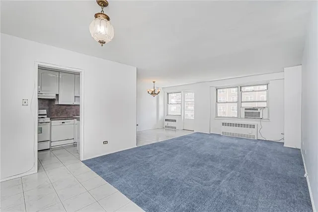 a view of an empty room with a window