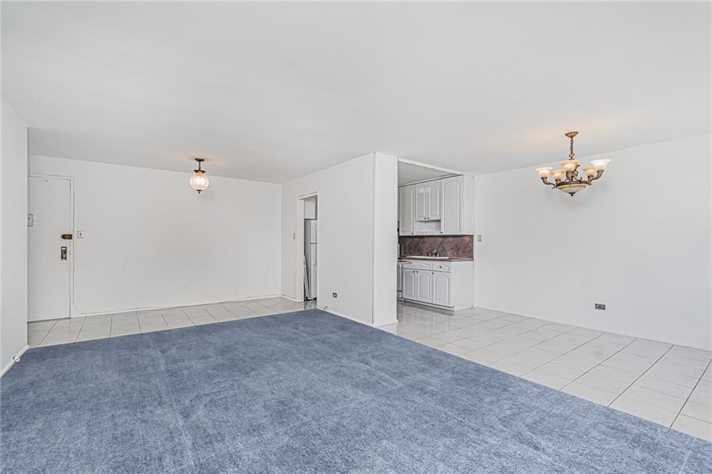 1935 Shore Parkway, Unit 9F Brooklyn, NY 11214 - Photo 5 of 20 a view of empty room with a kitchen