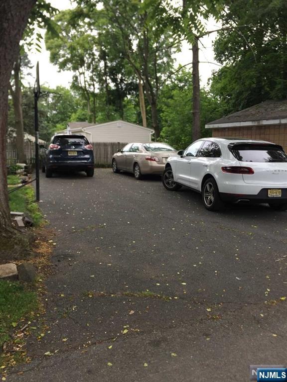 282 South Broad Street, Unit 2 FRONT DOOR Ridgewood, NJ 07450 - Photo 13 of 13 a view of cars parked in a parking lot
