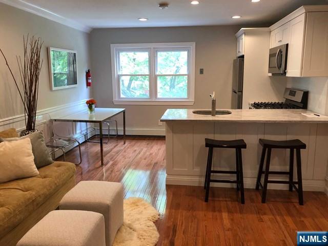 282 South Broad Street, Unit 2 FRONT DOOR Ridgewood, NJ 07450 - Photo 2 of 13 a living room with furniture and a window