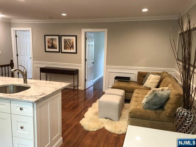 282 South Broad Street, Unit 2 FRONT DOOR Ridgewood, NJ 07450 - Photo 3 of 13 a living room with furniture and a fireplace