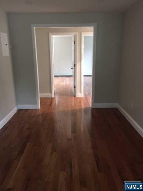 282 South Broad Street, Unit 2 FRONT DOOR Ridgewood, NJ 07450 - Photo 5 of 13 a view of a room with wooden floor and closet