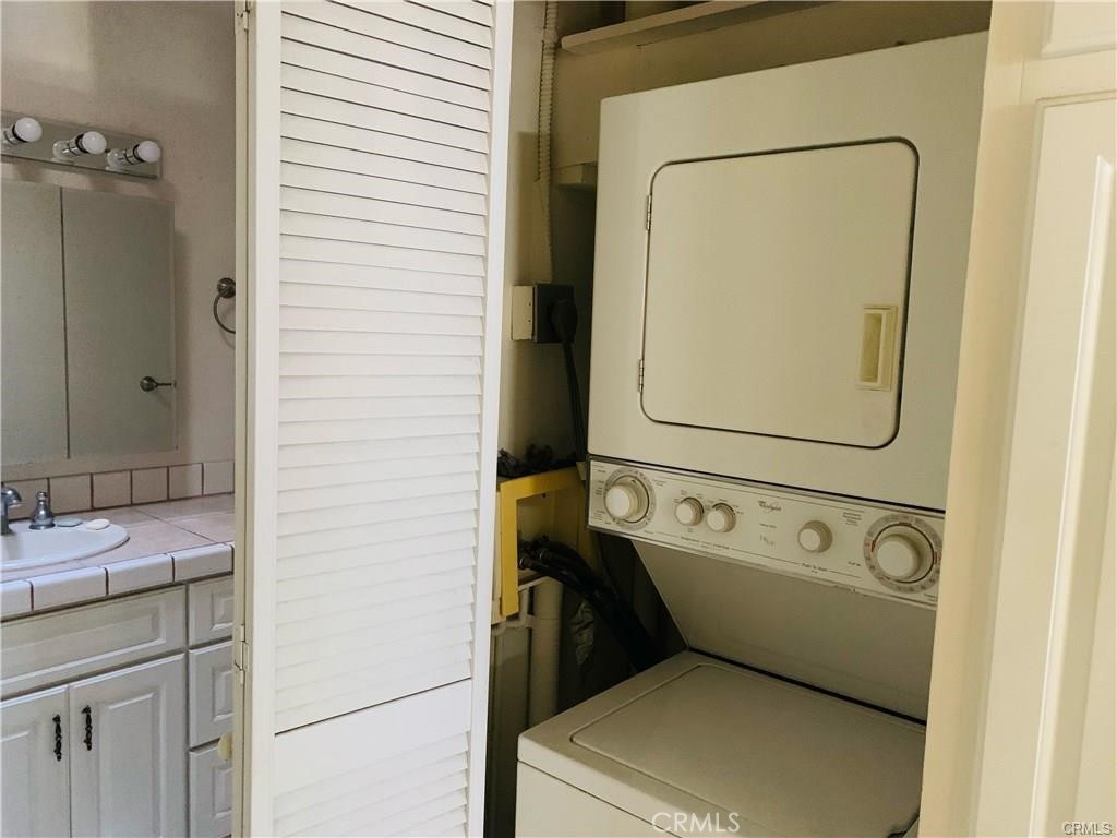 2276 Via Mariposa East, Unit R Laguna Woods, CA 92637 - Photo 7 of 9 a utility room with dryer and washer