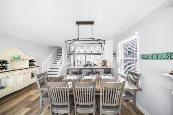 a view of a dining room with furniture and wooden floor