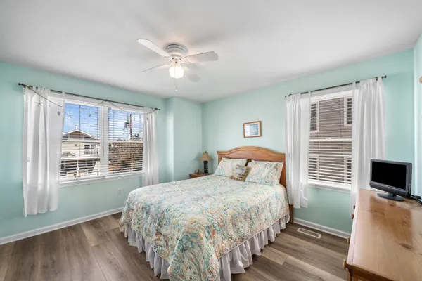a bedroom with a large bed and a tv