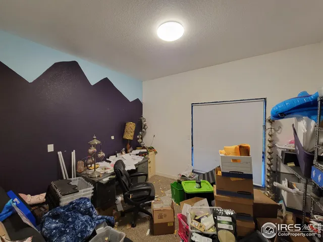 a living room with furniture and a mirror