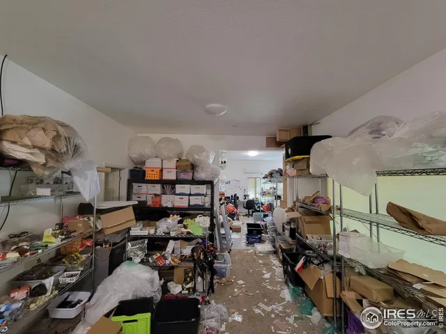 a room with lots of furniture and clutter