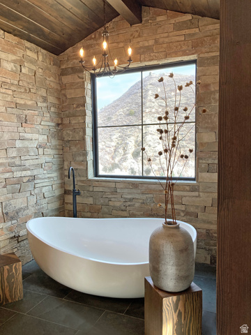 259 Meadow Drive Springville, UT 84663 - Photo 21 of 62 Bathroom featuring a wooden ceiling with exposed beams, a freestanding bath, and a mountain view