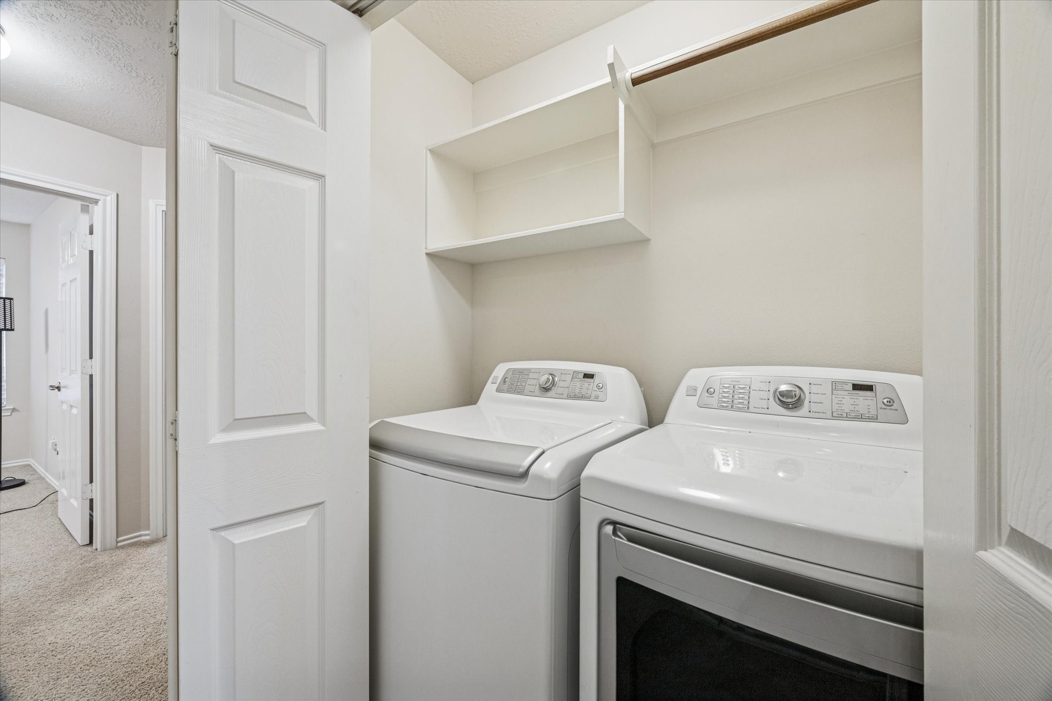 3206 Pearl Bluff Lane Houston, TX 77047 - Photo 18 of 20 a utility room with dryer and washer